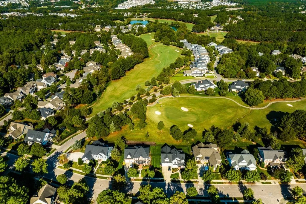 Aerial view of homes and a golf course community in Wake Forest, NC